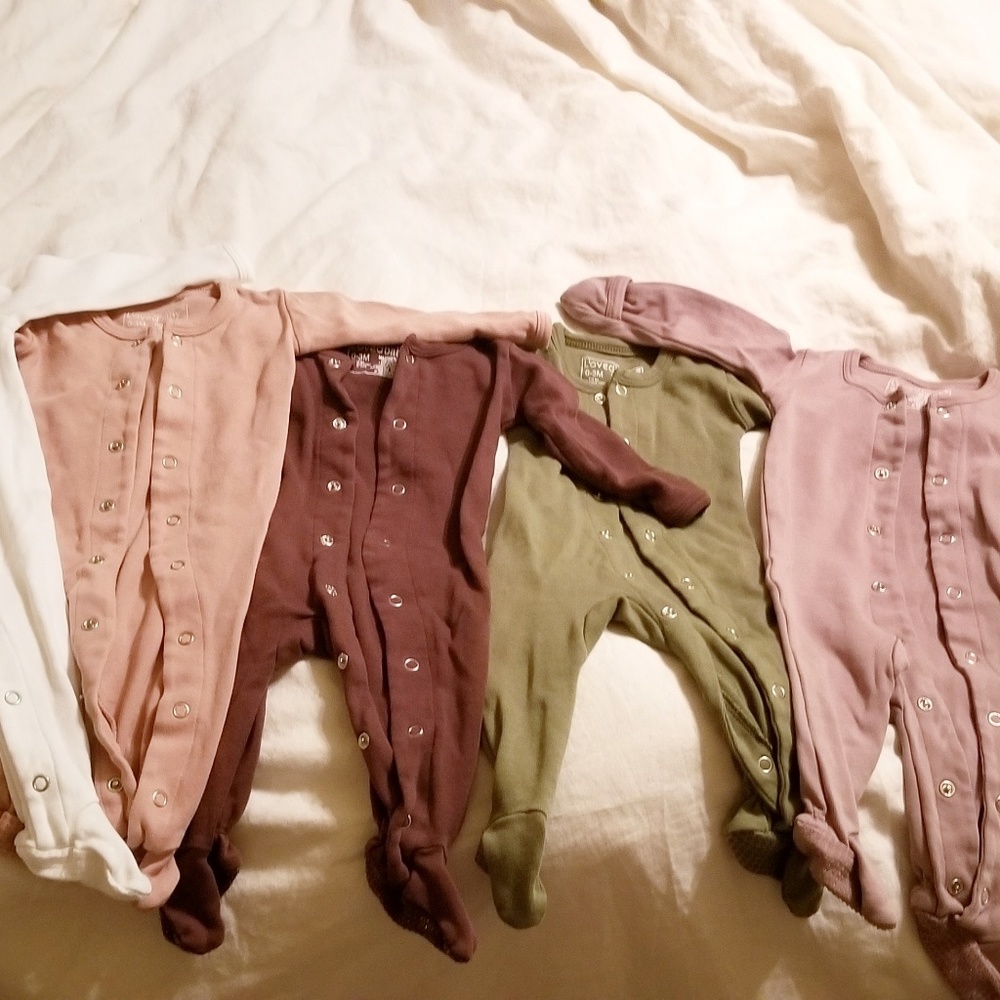 6 Brand new L'oved Baby onesies and matching cap.